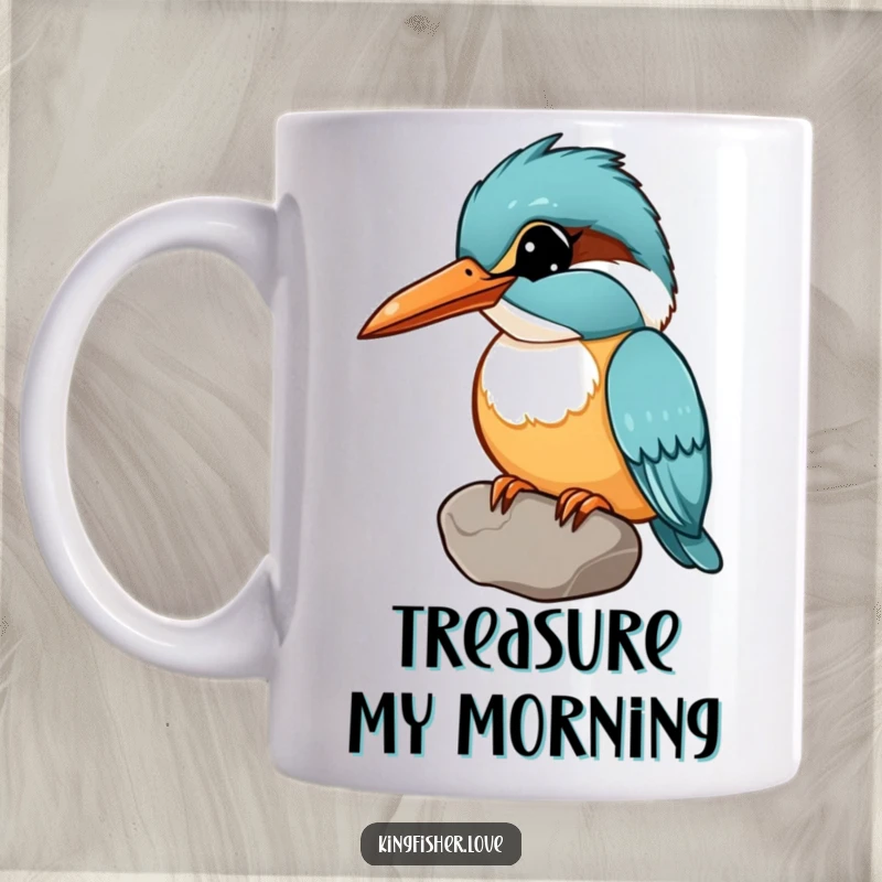 Funny mug depicting a kingfisher holding a shiny pebble in its beak, with its head tilted curiously.